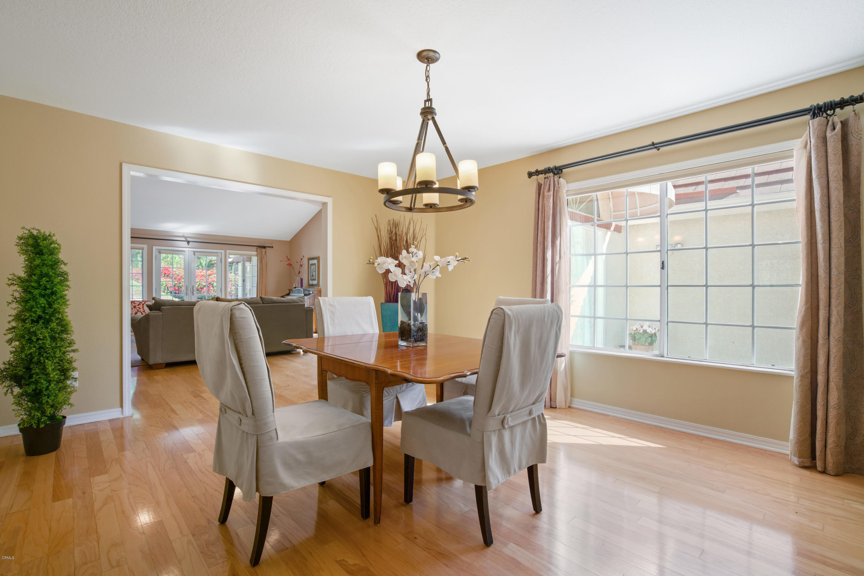 6670 Armitos Drive Camarillo, CA 93012 - Photo 9 of 35 a dining room with furniture a chandelier and wooden floor