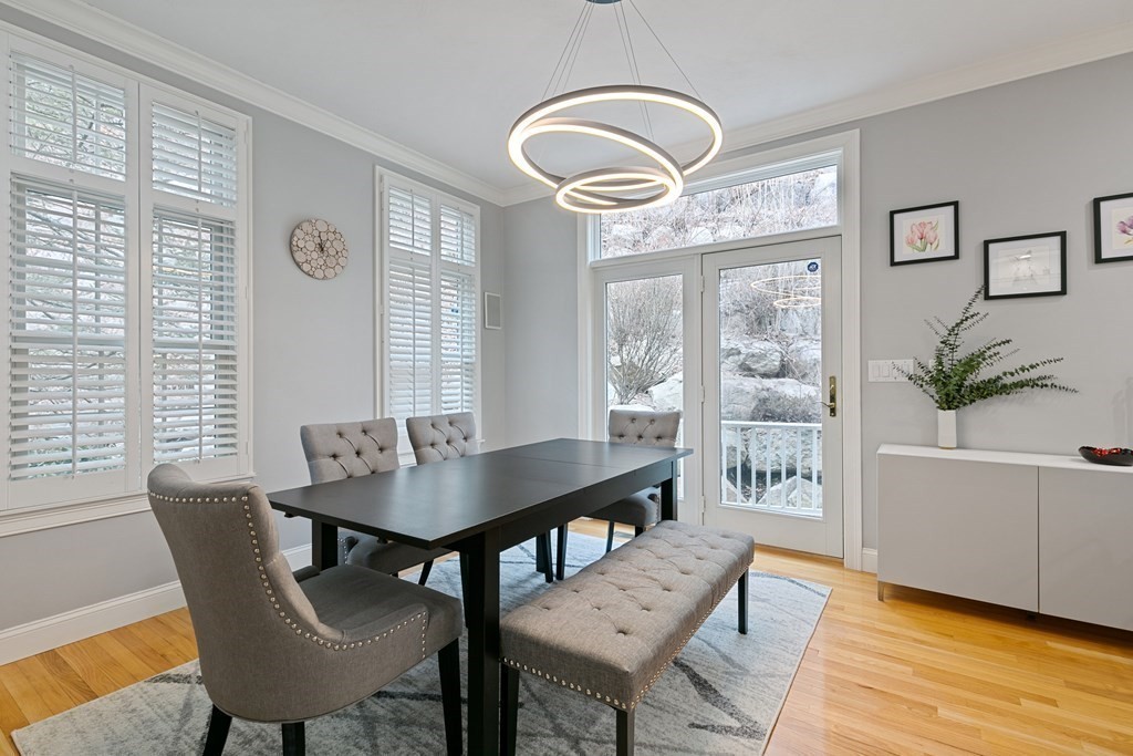 9 Chestnut Lane, Unit 9 Lexington, MA 02421 - Photo 6 of 32 a view of a dining room with furniture window and wooden floor
