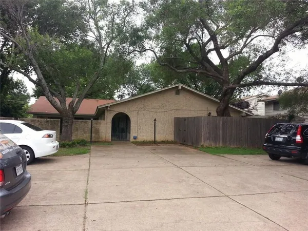 a view of a car in front of a house