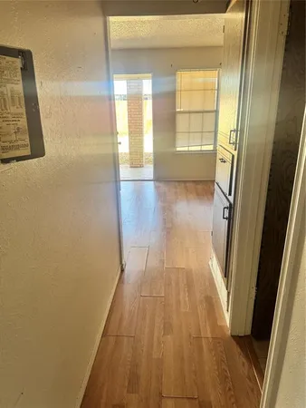 a view of hallway with natural light