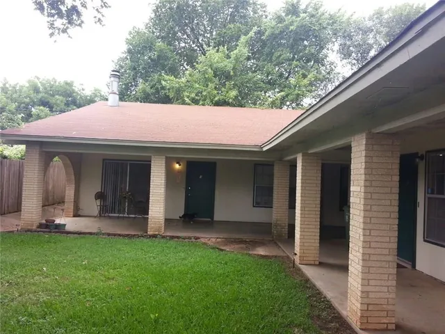 a view of a house with a garden