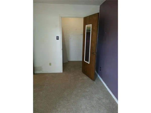 a view of a room with a hallway