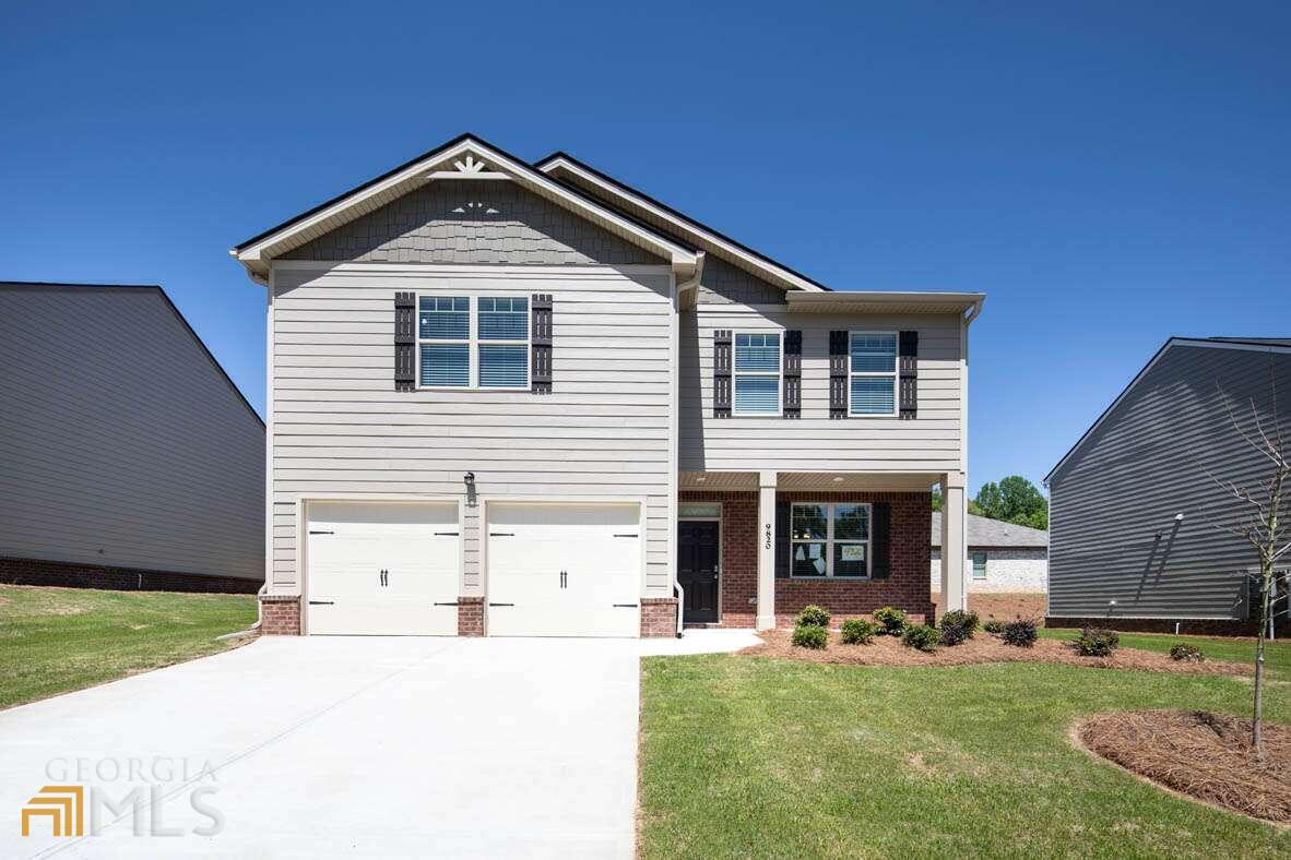 1082 Rigby Court Southeast, Unit VIVIAN/24 Atlanta, GA 30354 - Photo 1 of 1 a front view of a house with a yard