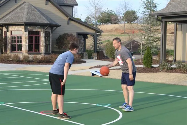 a front view of a house with a yard table and chairs