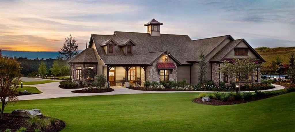 915 Edgewater Trail Toccoa, GA 30577 - Photo 20 of 22 a front view of a house with a yard table and chairs