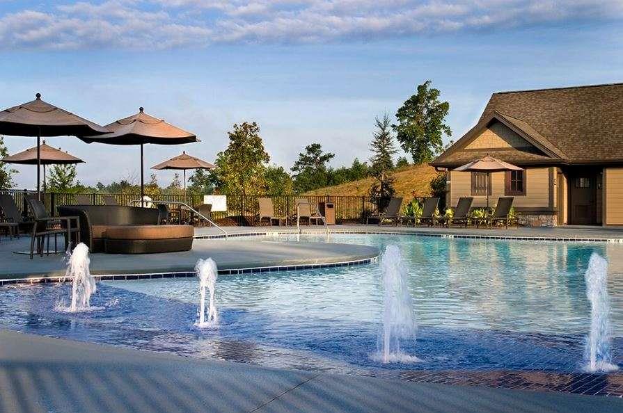 915 Edgewater Trail Toccoa, GA 30577 - Photo 21 of 22 a view of pool with lawn chairs under an umbrella