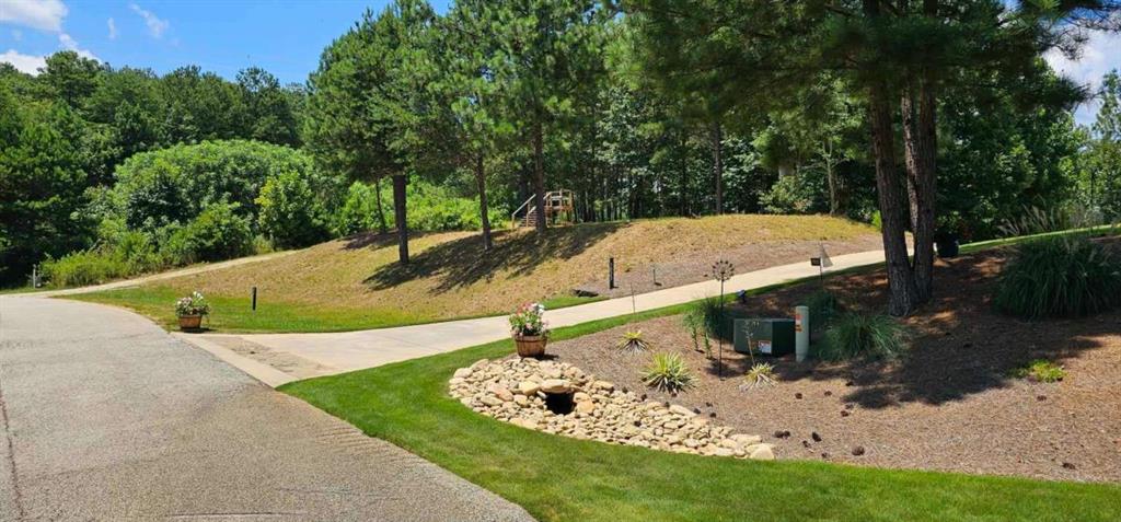 915 Edgewater Trail Toccoa, GA 30577 - Photo 3 of 22 a view of a swimming pool with a yard