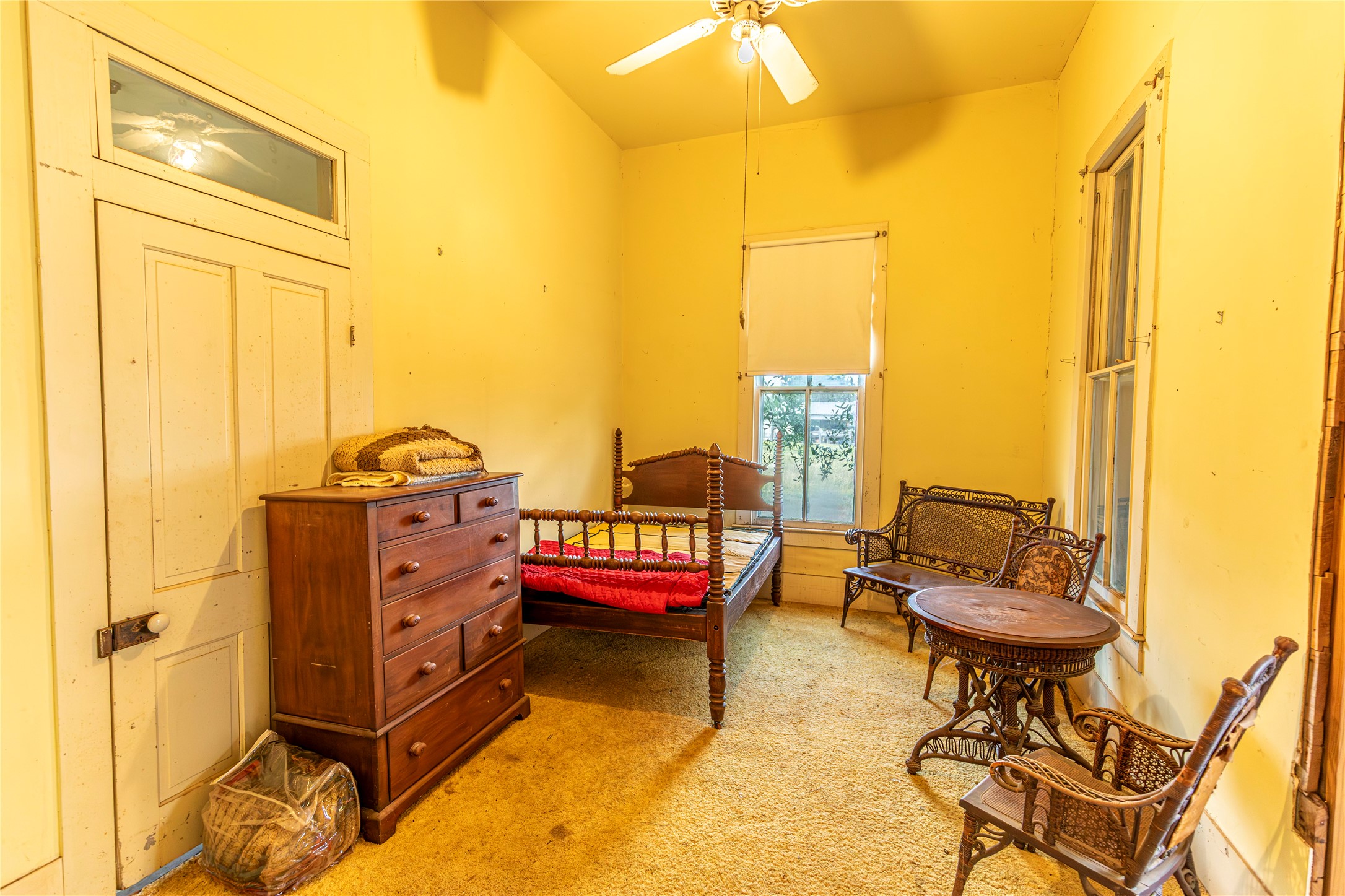 768 Travis Road Bellville, TX 77418 - Photo 9 of 17 Bedroom- check out that transom above the door.