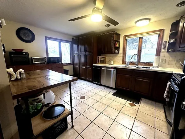 a kitchen with stainless steel appliances granite countertop a stove and a sink