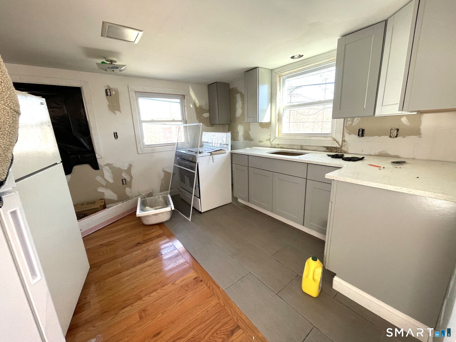 a kitchen that has a sink and a stove in it