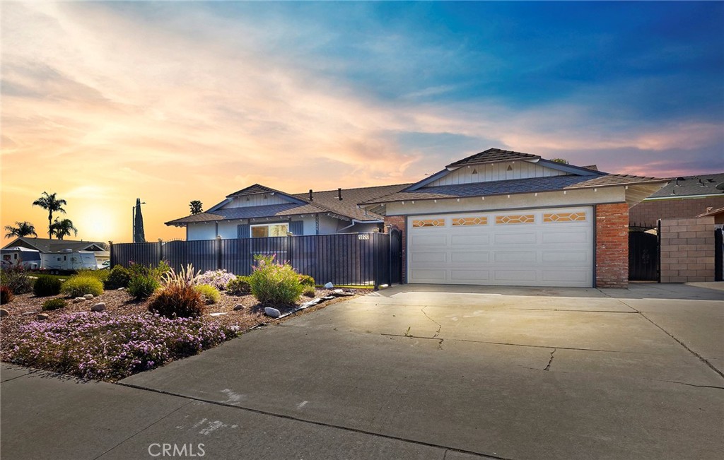 5920 Havilland Lane Riverside, CA 92504 - Photo 1 of 1 a front view of a house with a yard and garage
