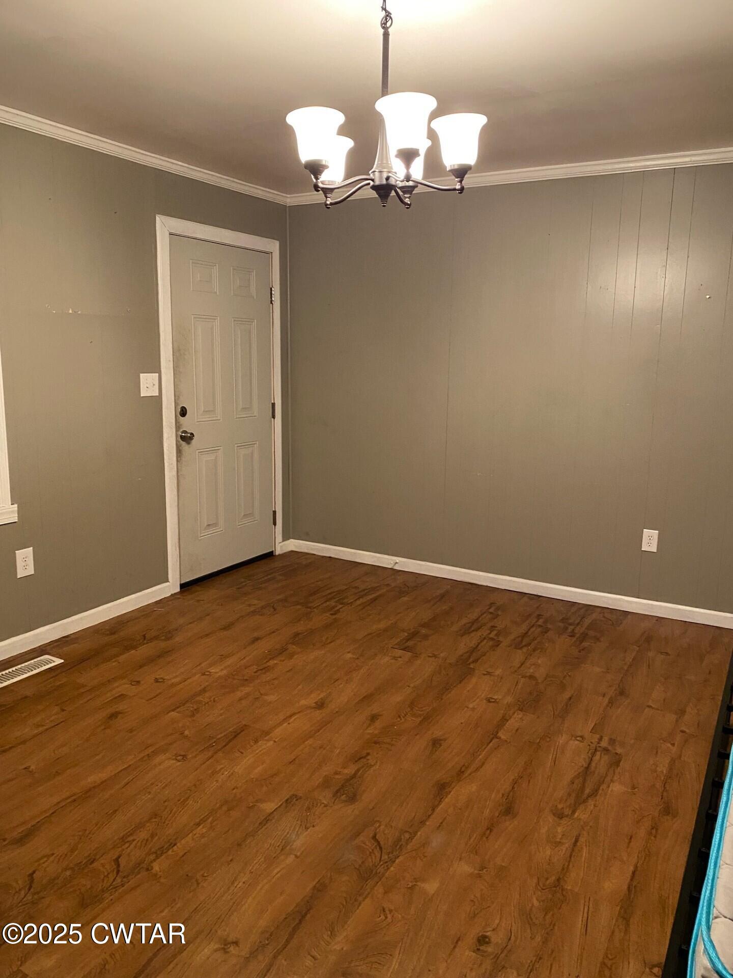 268 West Main Street Hornbeak, TN 38232 - Photo 11 of 11 a view of a room with wooden floor and chandelier