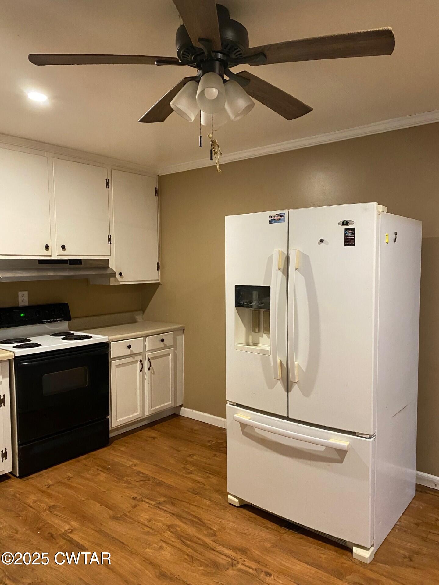 268 West Main Street Hornbeak, TN 38232 - Photo 4 of 11 a white refrigerator freezer sitting inside of a kitchen