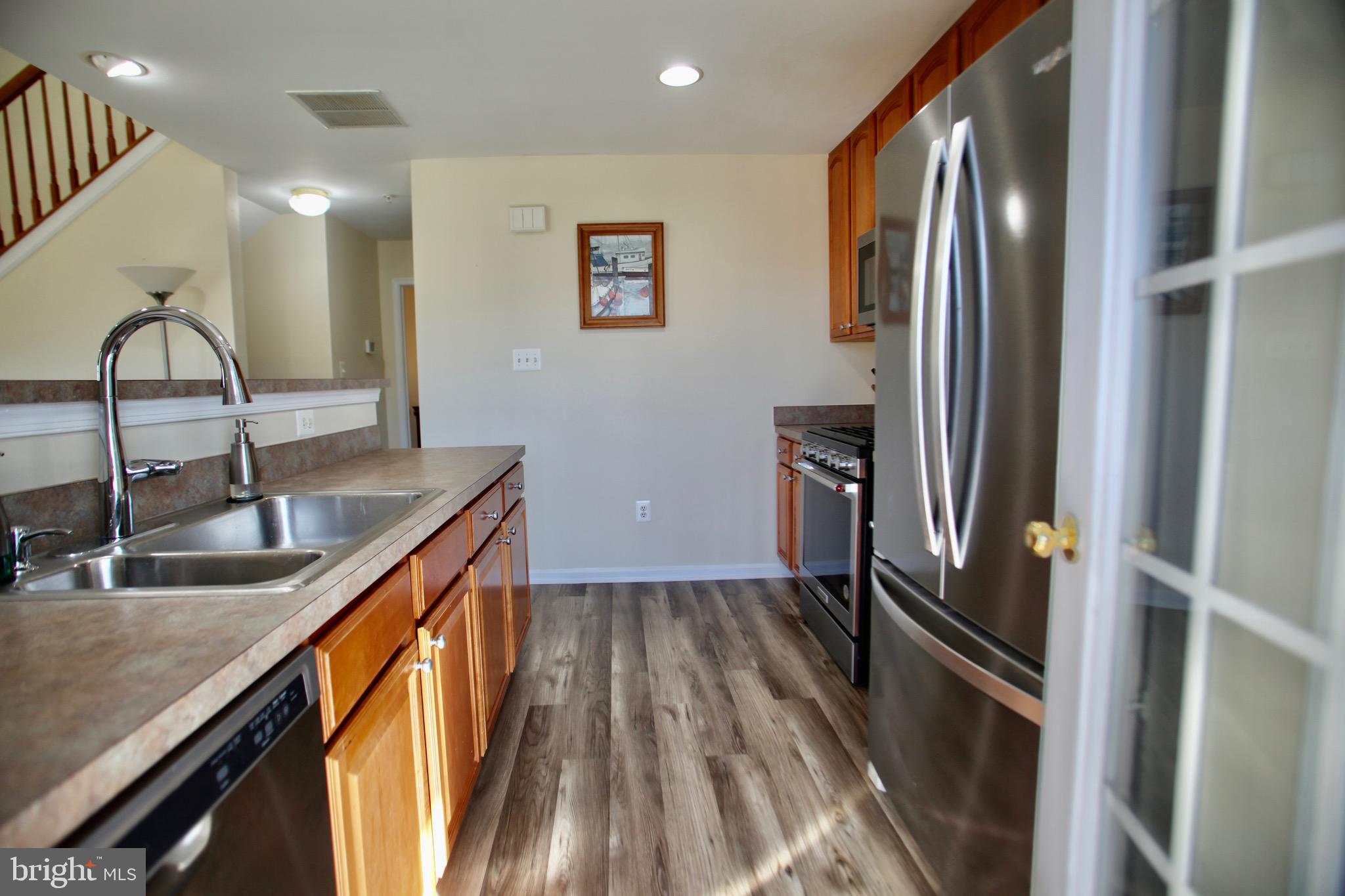 2013 Astilbe Way, Unit 2013 Odenton, MD 21113 - Photo 11 of 61 a kitchen with a sink appliances and cabinets