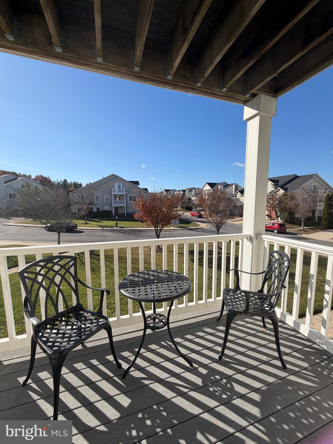 2013 Astilbe Way, Unit 2013 Odenton, MD 21113 - Photo 14 of 61 a view of a balcony with chairs and wooden floor