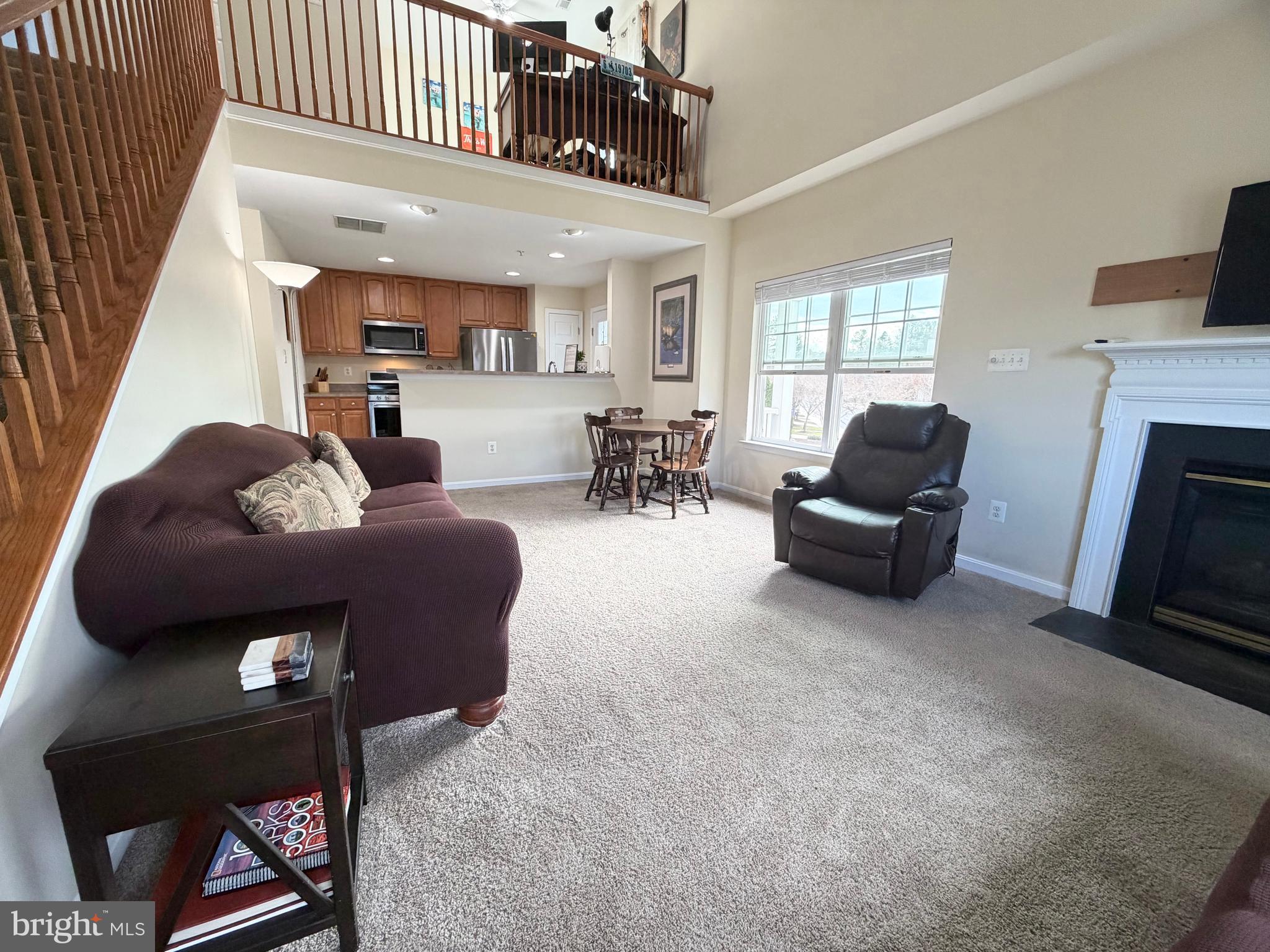 2013 Astilbe Way, Unit 2013 Odenton, MD 21113 - Photo 16 of 61 a living room with furniture and a fireplace