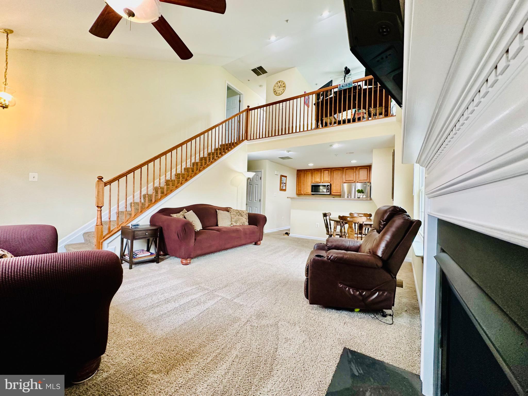 2013 Astilbe Way, Unit 2013 Odenton, MD 21113 - Photo 18 of 61 a living room with furniture ceiling fan and a rug