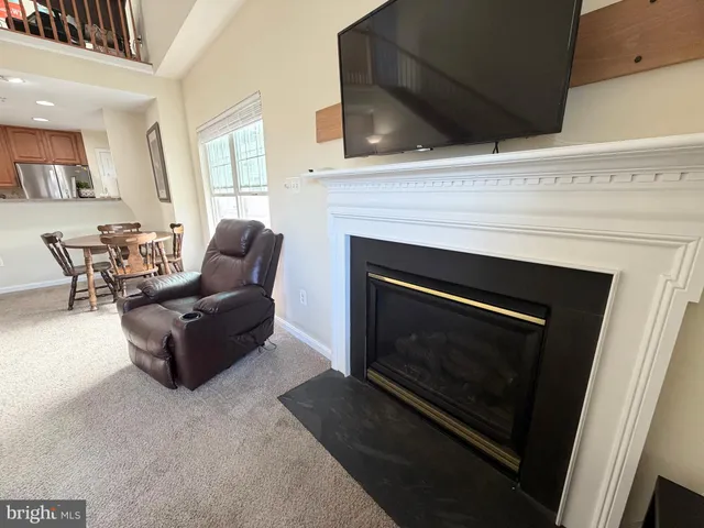 a bedroom with furniture and a flat screen tv