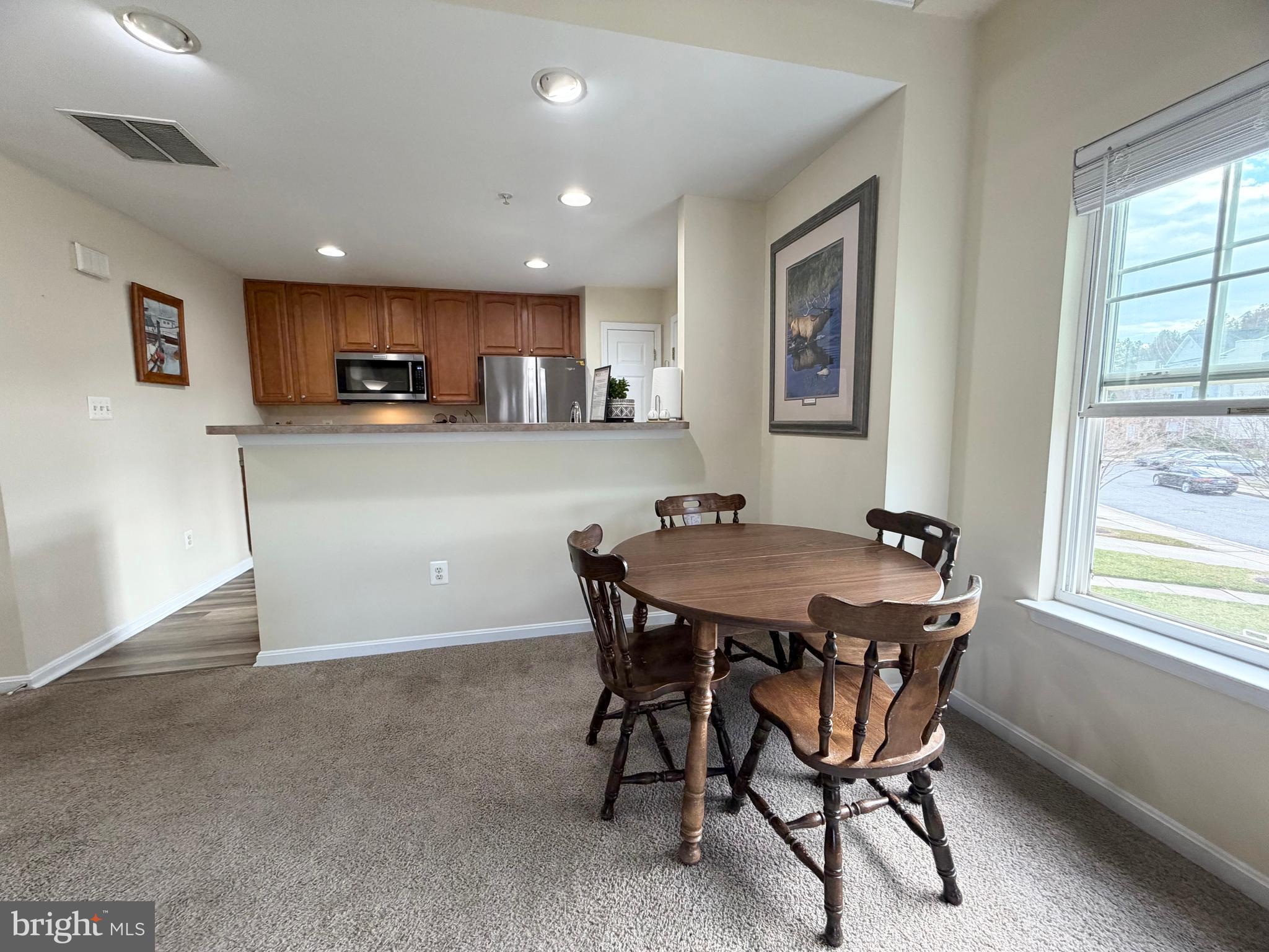 2013 Astilbe Way, Unit 2013 Odenton, MD 21113 - Photo 20 of 61 a view of a dining room with furniture