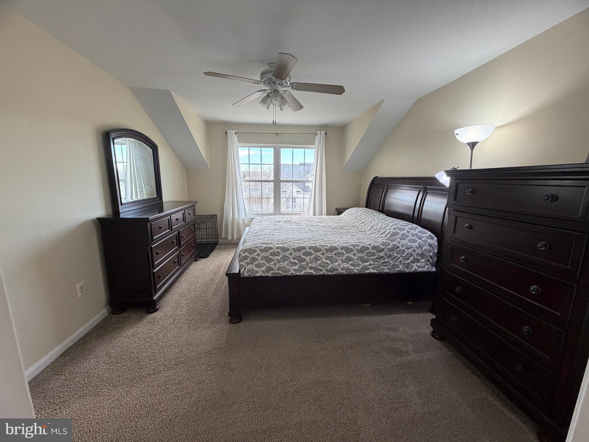 2013 Astilbe Way, Unit 2013 Odenton, MD 21113 - Photo 32 of 61 a bedroom with a bed dresser and a window