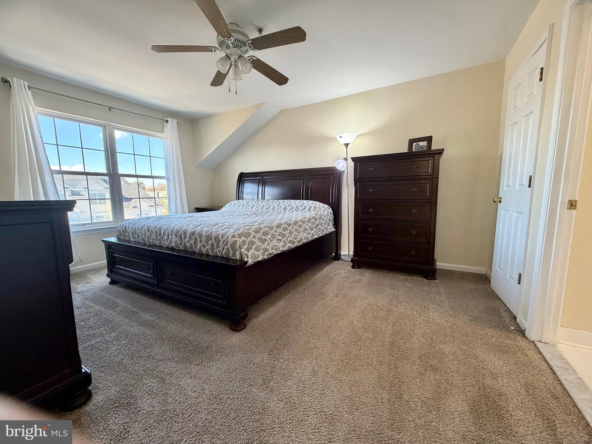 2013 Astilbe Way, Unit 2013 Odenton, MD 21113 - Photo 33 of 61 a spacious bedroom with a bed and window