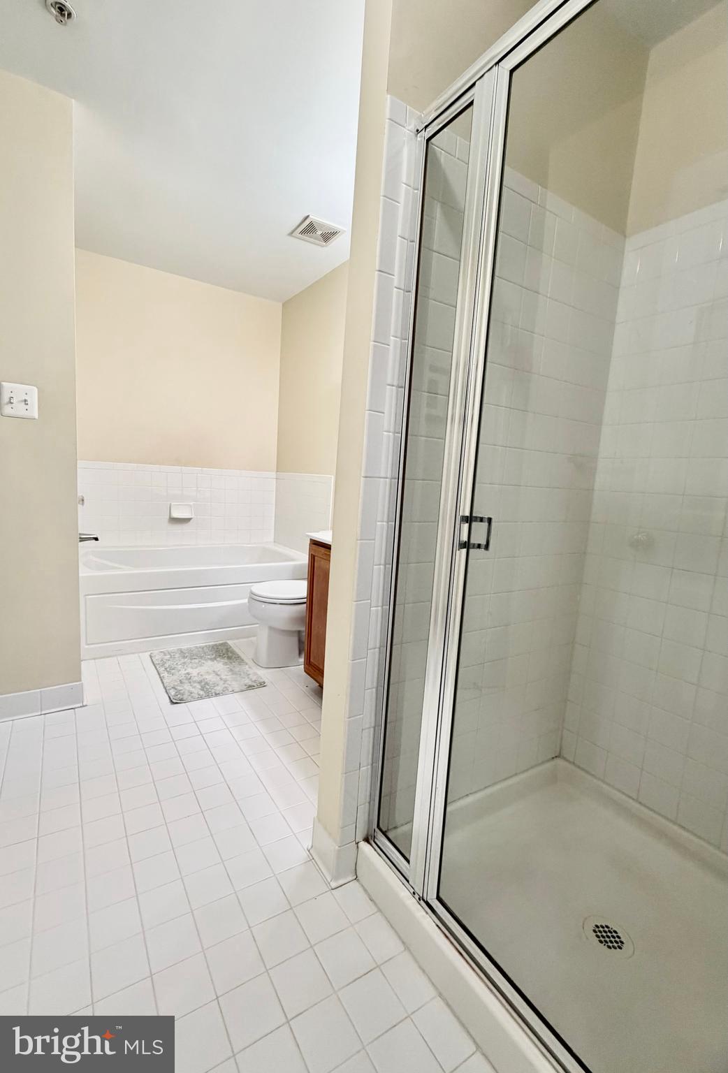 2013 Astilbe Way, Unit 2013 Odenton, MD 21113 - Photo 35 of 61 a bathroom with a tub and a shower