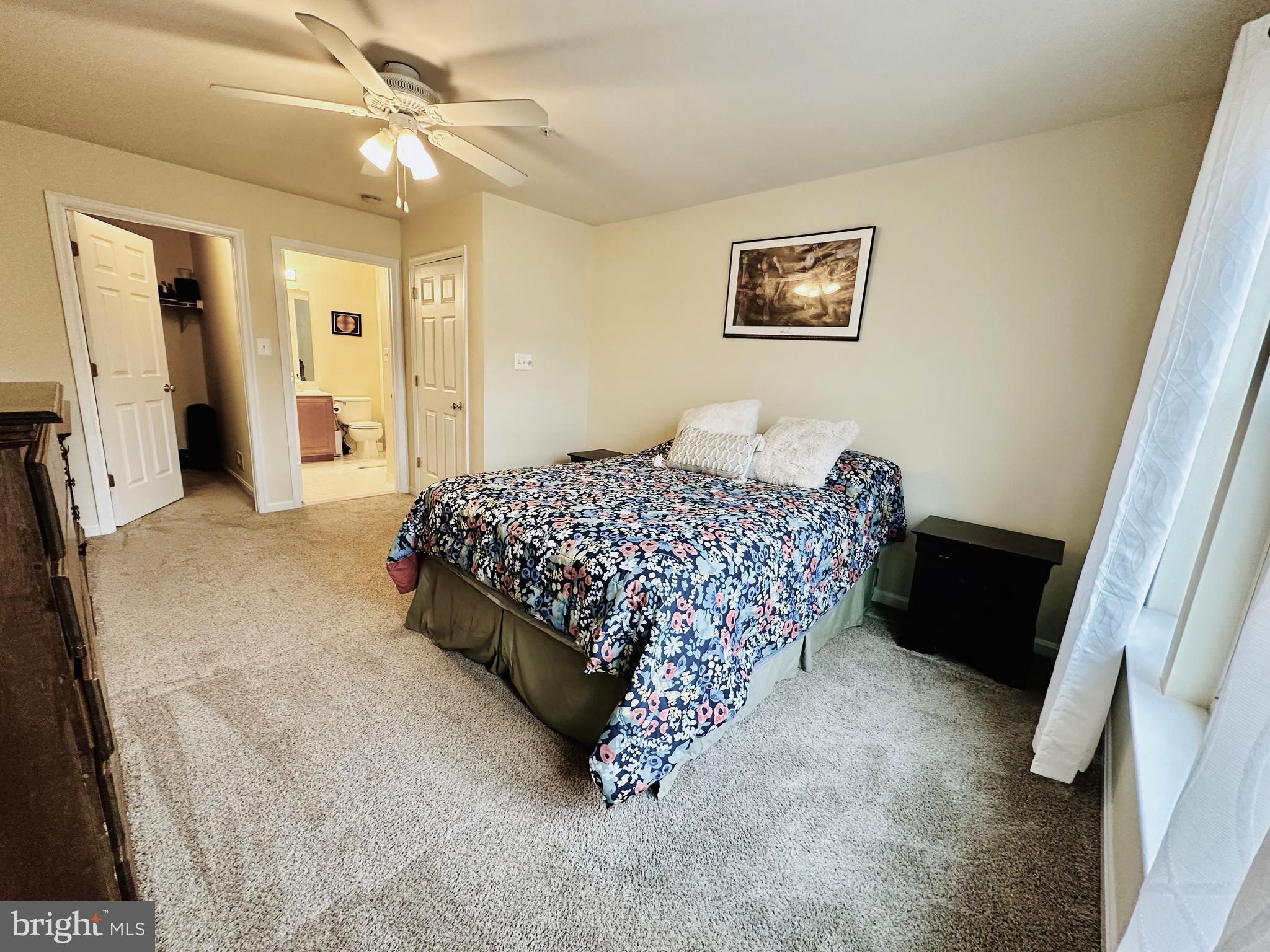 2013 Astilbe Way, Unit 2013 Odenton, MD 21113 - Photo 42 of 61 a bedroom with a bed and a chandelier