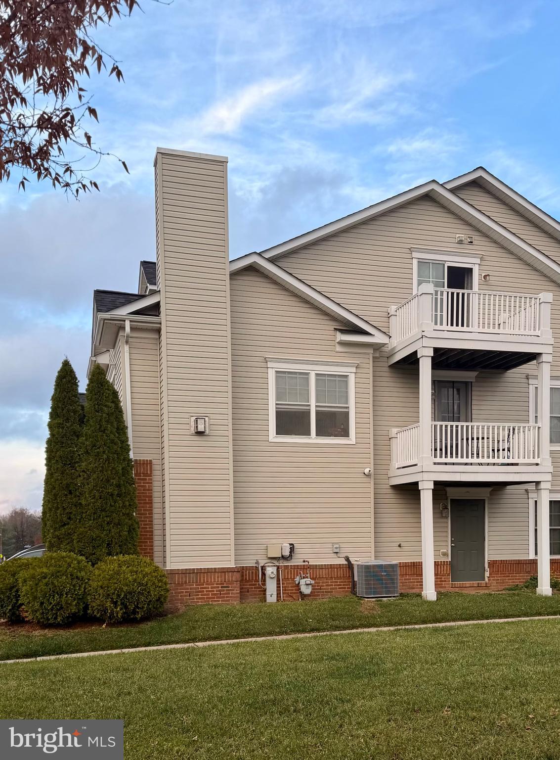 2013 Astilbe Way, Unit 2013 Odenton, MD 21113 - Photo 51 of 61 a front view of a house with a garden