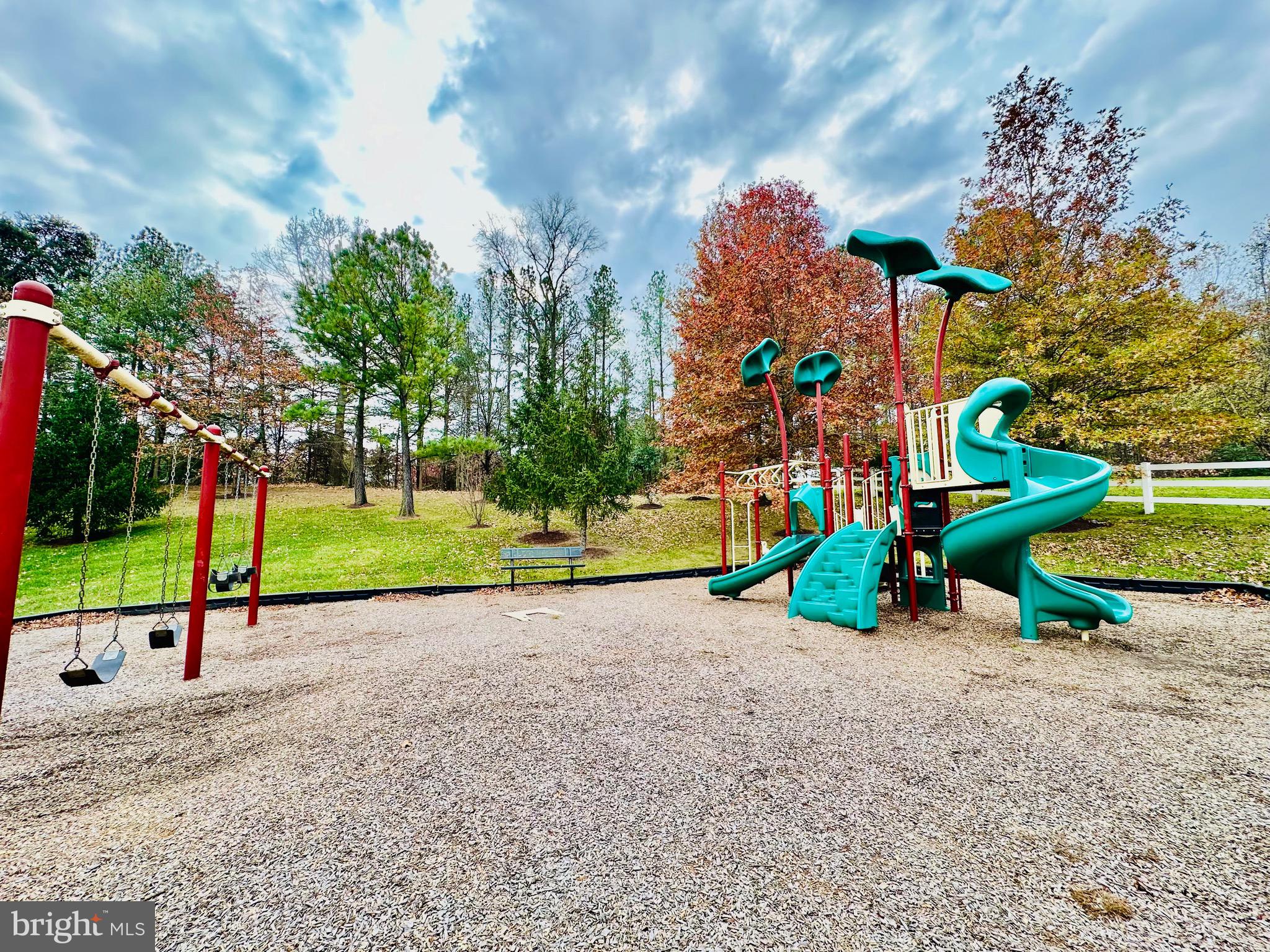 2013 Astilbe Way, Unit 2013 Odenton, MD 21113 - Photo 54 of 61 a view of a park with swings and slides