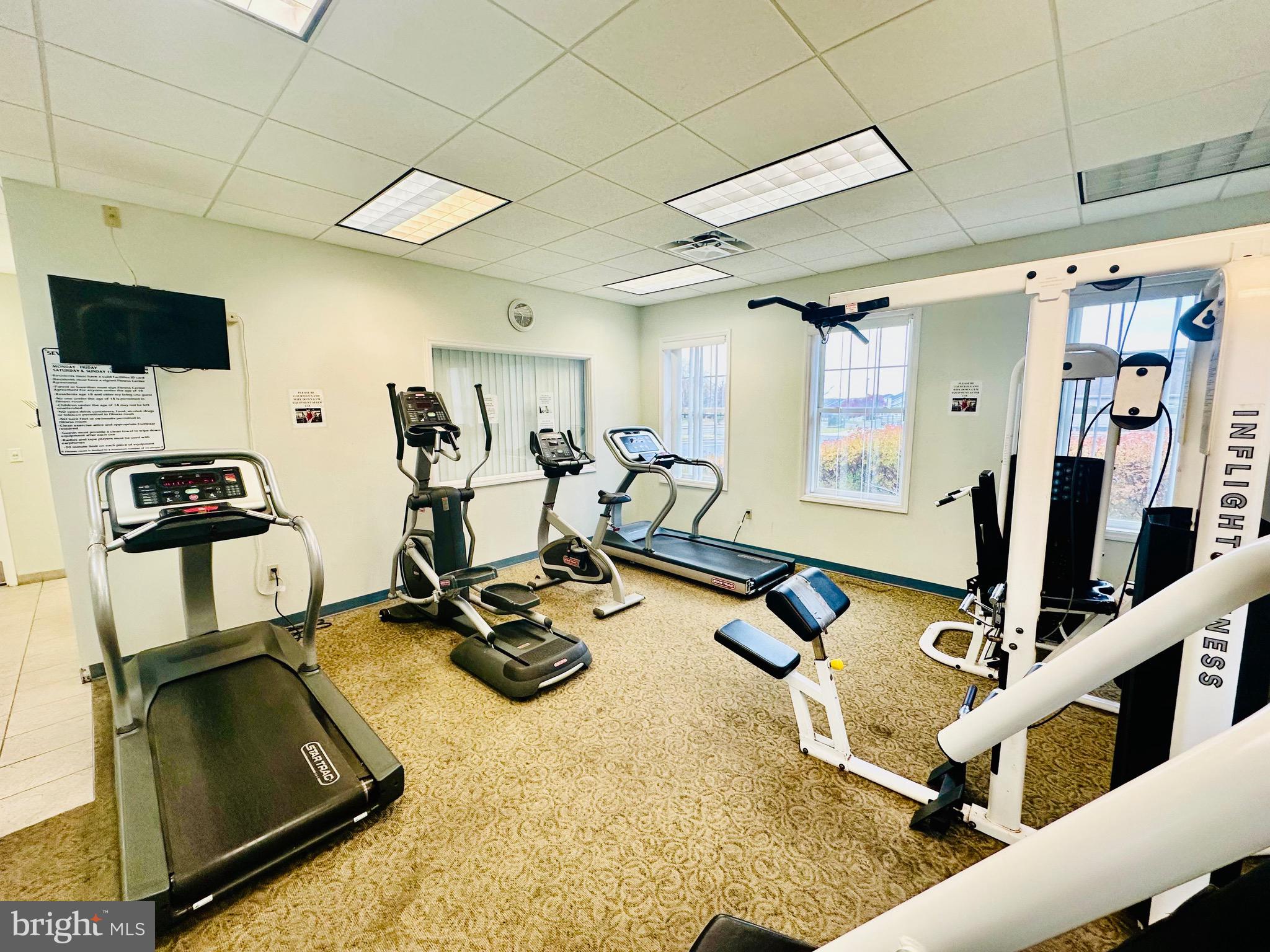 2013 Astilbe Way, Unit 2013 Odenton, MD 21113 - Photo 56 of 61 a room with gym equipment and a large window