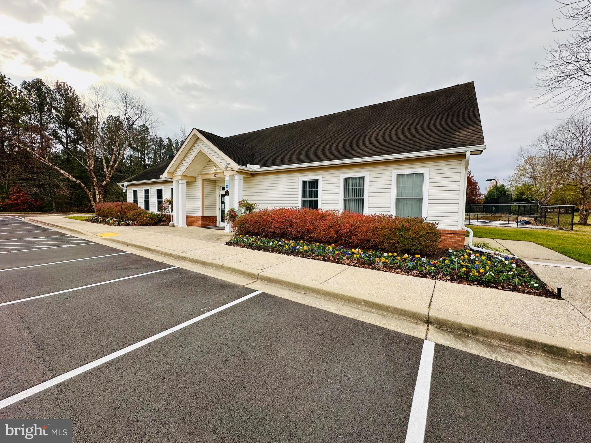 2013 Astilbe Way, Unit 2013 Odenton, MD 21113 - Photo 60 of 61 a front view of a house with a yard and garage