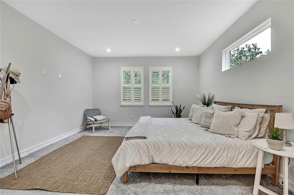 6098 North Peardale Terrace Beverly Hills, FL 34465 - Photo 17 of 59 a bedroom with a bed a chair and a window