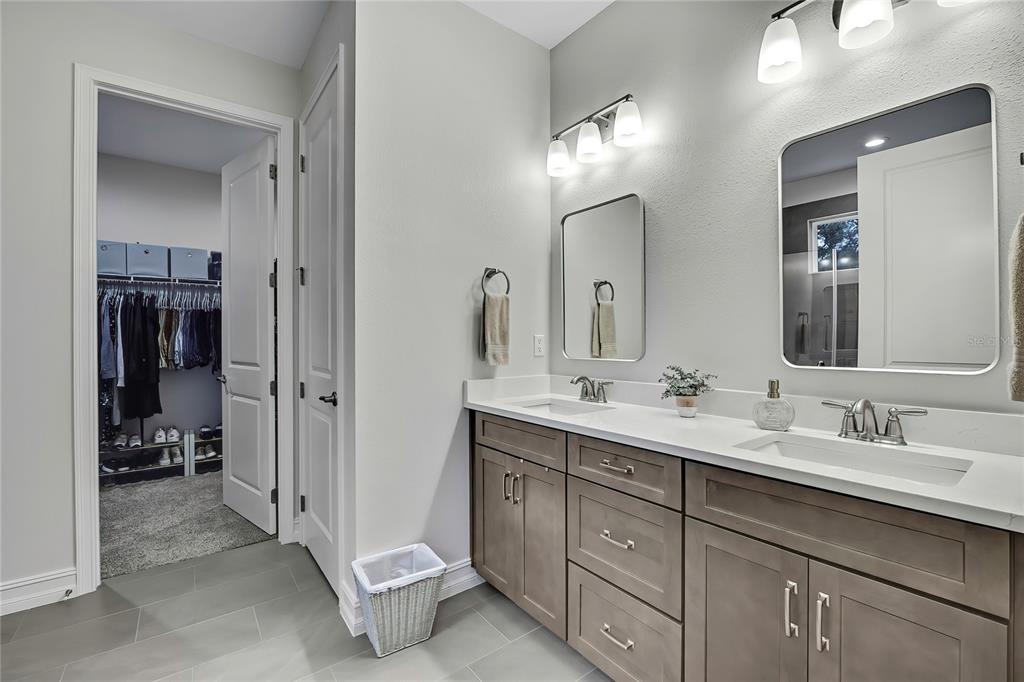 6098 North Peardale Terrace Beverly Hills, FL 34465 - Photo 20 of 59 a spacious bathroom with a double vanity sink double and mirror