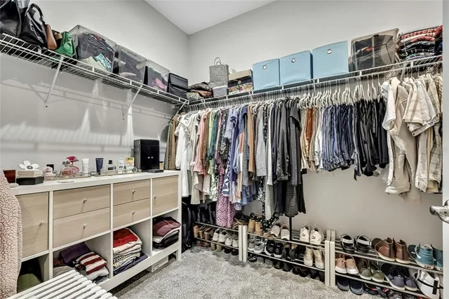 a bedroom with a bed and closet
