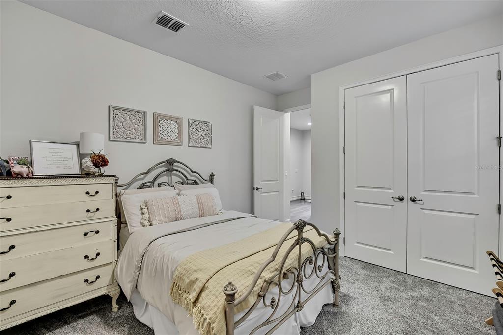 6098 North Peardale Terrace Beverly Hills, FL 34465 - Photo 30 of 59 a bedroom with a bed and a dresser