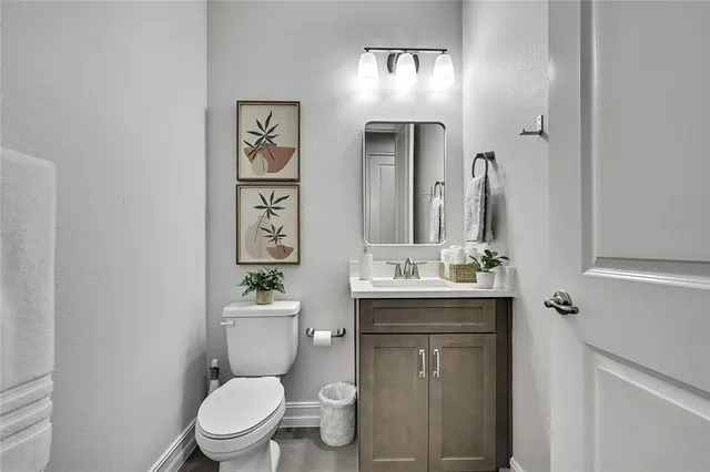 a building outdoor space with patio furniture and potted plants