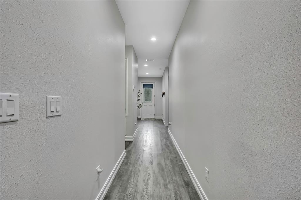 6098 North Peardale Terrace Beverly Hills, FL 34465 - Photo 35 of 59 a view of a hallway with wooden floor
