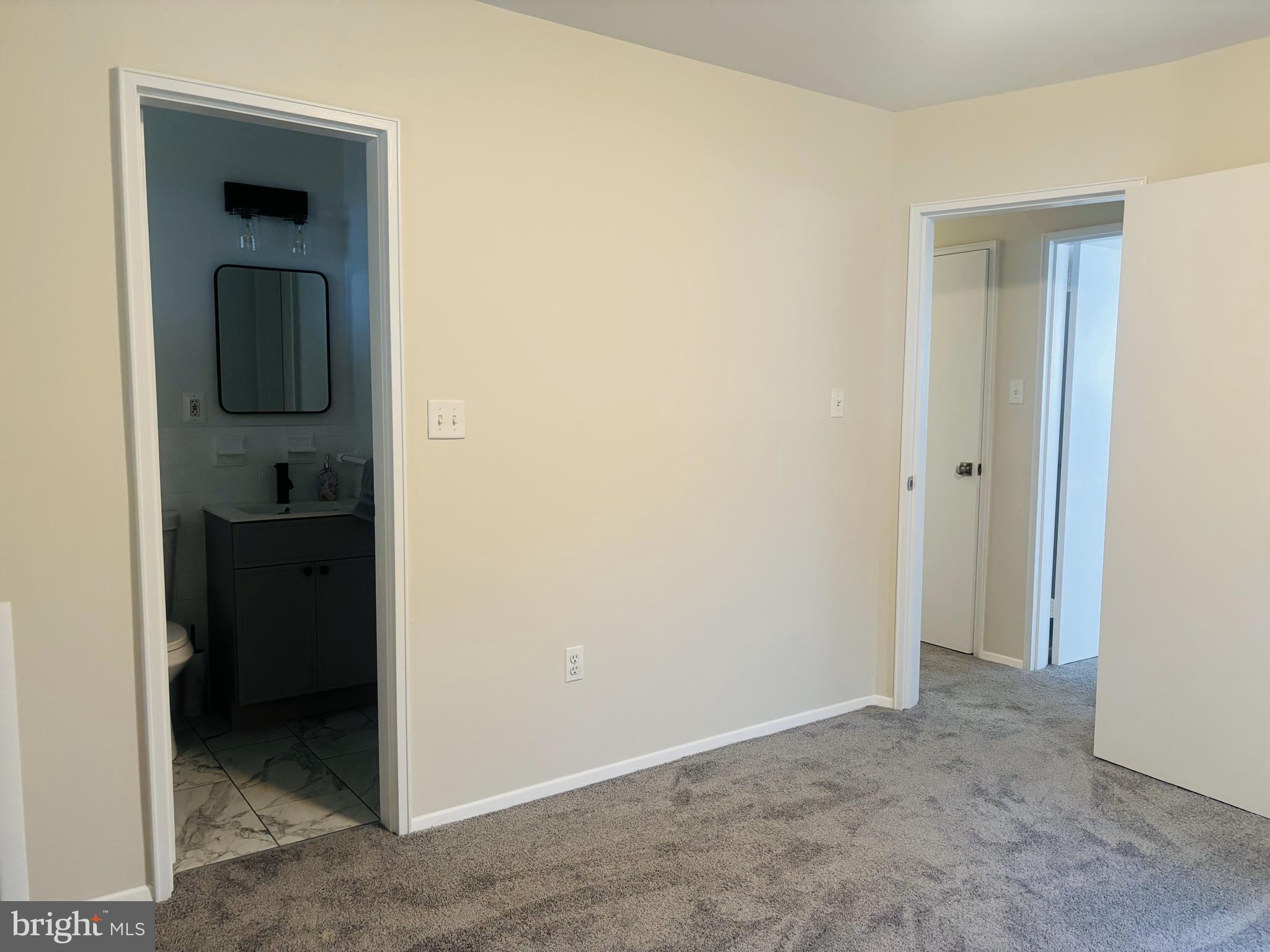 4714 Glenoak Road Hyattsville, MD 20784 - Photo 19 of 41 a view of a kitchen from the hallway