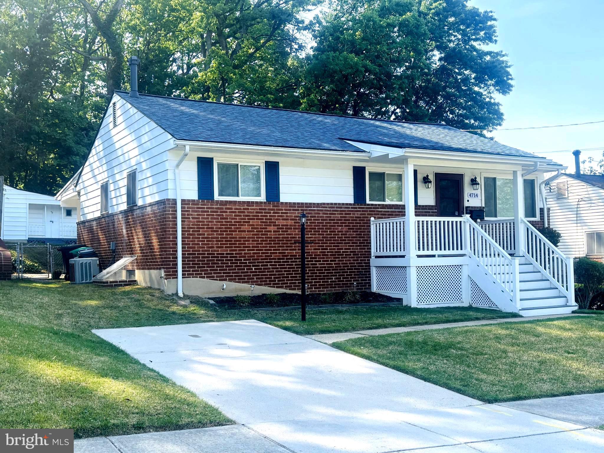 4714 Glenoak Road Hyattsville, MD 20784 - Photo 2 of 41 a front view of a house with a garden