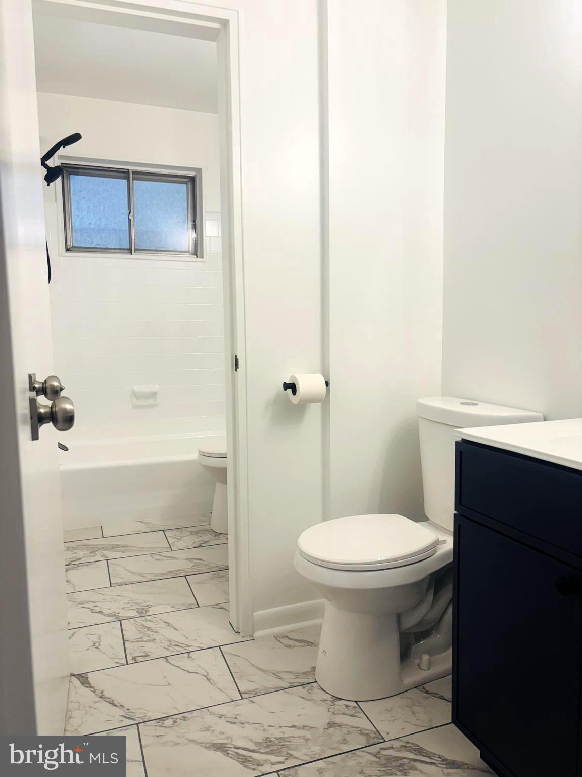 4714 Glenoak Road Hyattsville, MD 20784 - Photo 23 of 41 a bathroom with a toilet and a shower