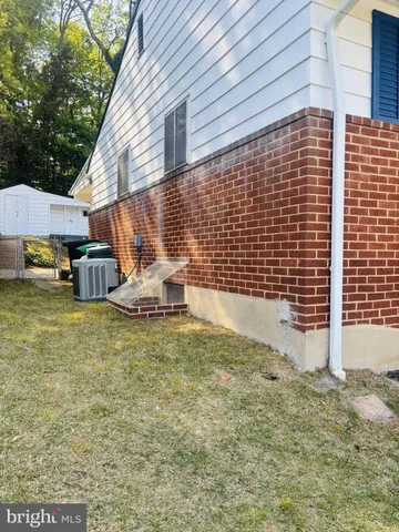 a swimming pool with outdoor seating and yard