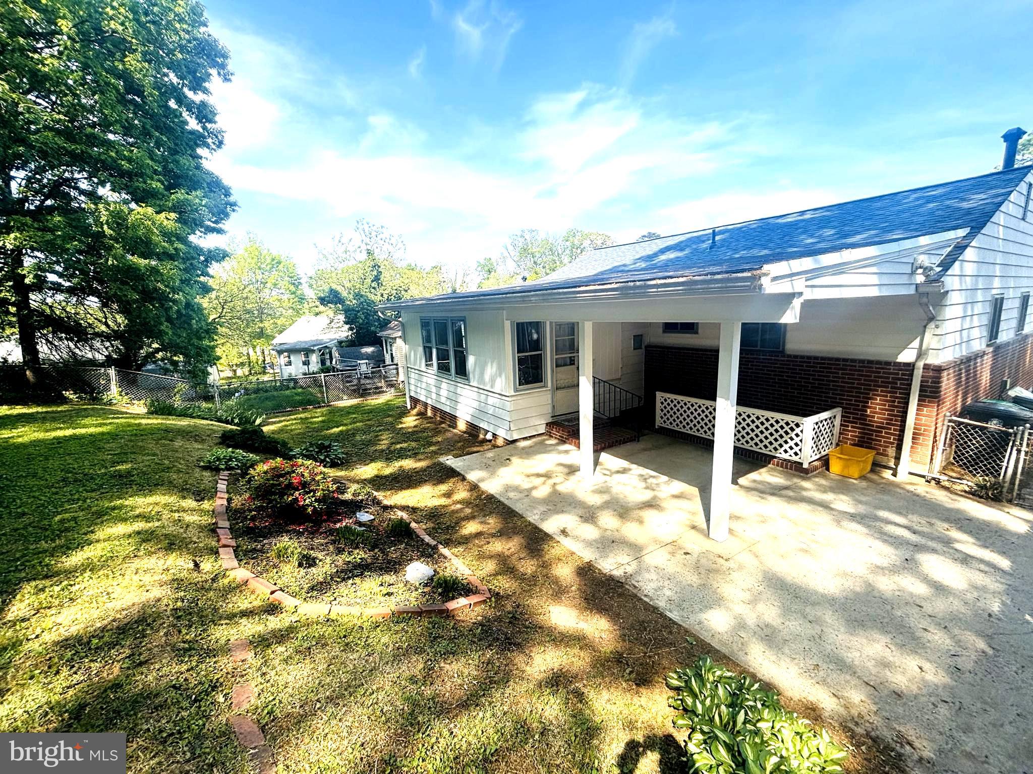 4714 Glenoak Road Hyattsville, MD 20784 - Photo 36 of 41 a view of a house with a backyard porch and sitting area