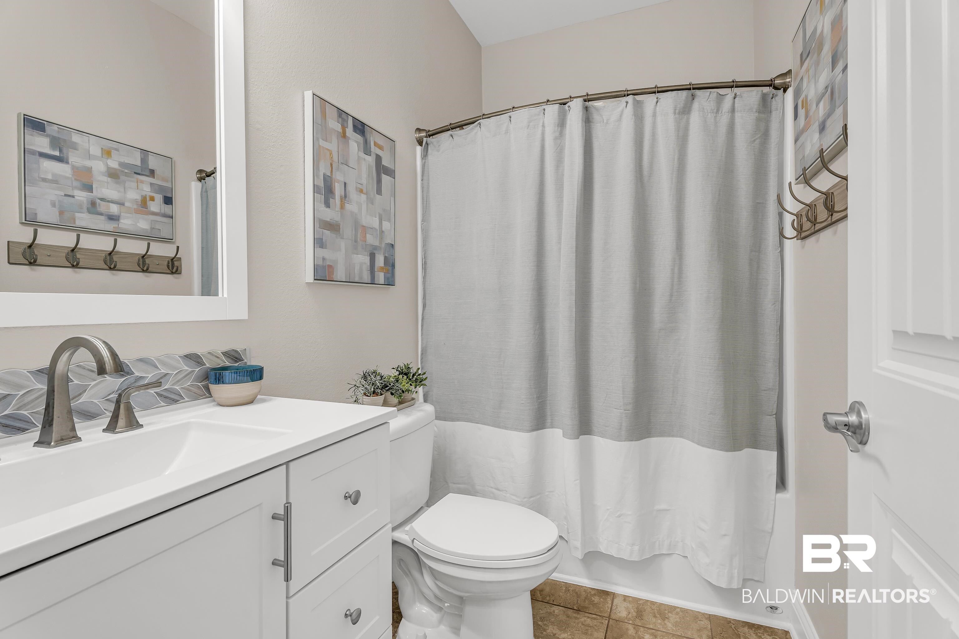 9675 Camberwell Drive Daphne, AL 36526 - Photo 18 of 34 Bathroom with vanity, shower / bath combo, and tile patterned floors