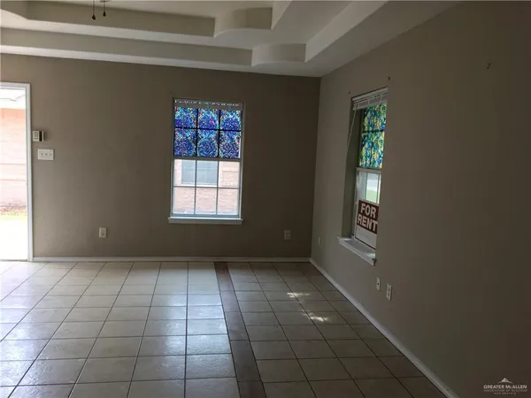a view of an empty room and window