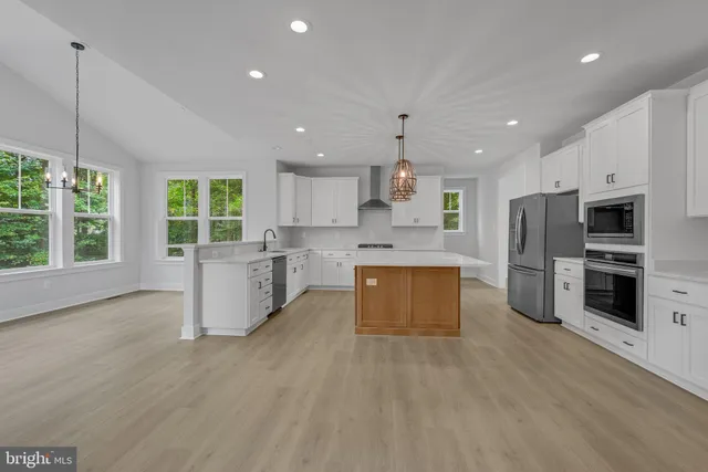 a kitchen with cabinets a window and a sink