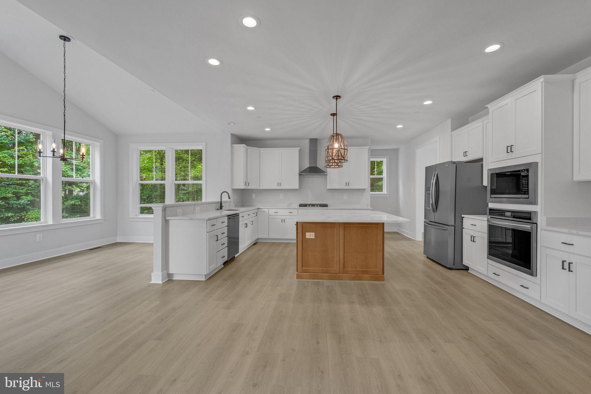 2229 A Ady Road Forest Hill, MD 21050 - Photo 14 of 75 a large kitchen with stainless steel appliances kitchen island granite countertop a large counter top stainless steel appliances and cabinets