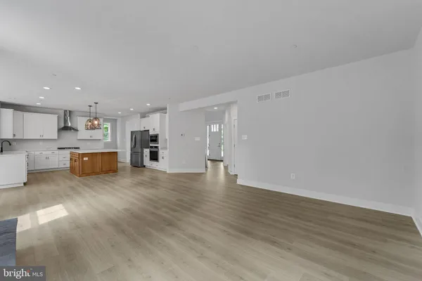 a view of an empty room with a fireplace