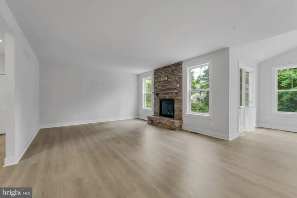 a view of an empty room with windows