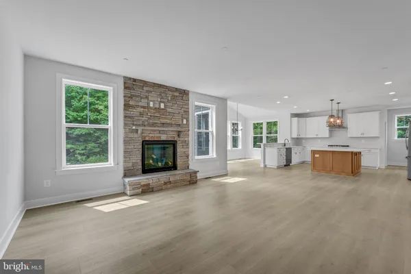 a view of a closet area with hardwood floor