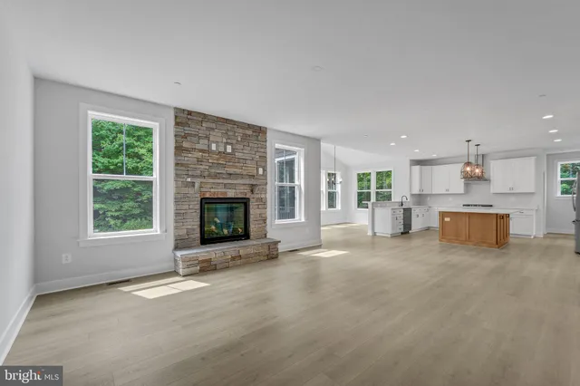 a view of a closet area with hardwood floor